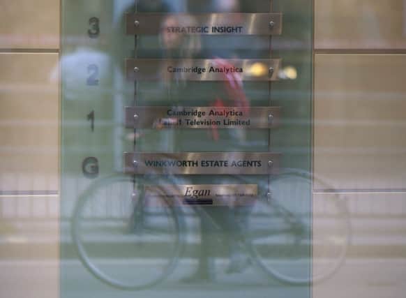 A sign in the foyer at the offices of Cambridge Analytica in central London as a court heard the company has offered to hand over evidence to the Information Commissioner. Picture: Yui Mok/PA Wire