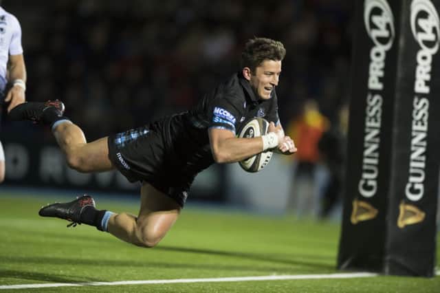 With a smile etched across his face, Glasgow Warriors DTH van Der Merwe scores a bonus-point try at Scotstoun. Picture: SNS