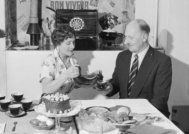 Fanny Cradock serves tea to her husband Johnnie (Picture: Getty)