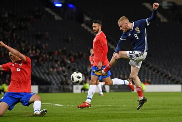 Scotland debutant Oli McBurnie takes a shot at goal. Picture: Rob Casey/SNS