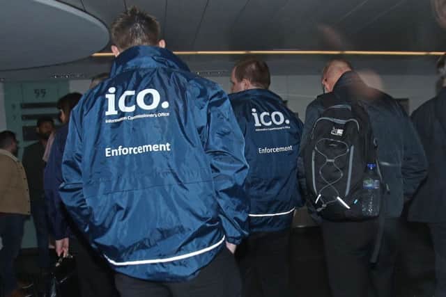 Enforcement officers working for the Information Commissioner's Office entering the offices of Cambridge Analytica in central London after a High Court judge granted a search warrant. Picture; PA