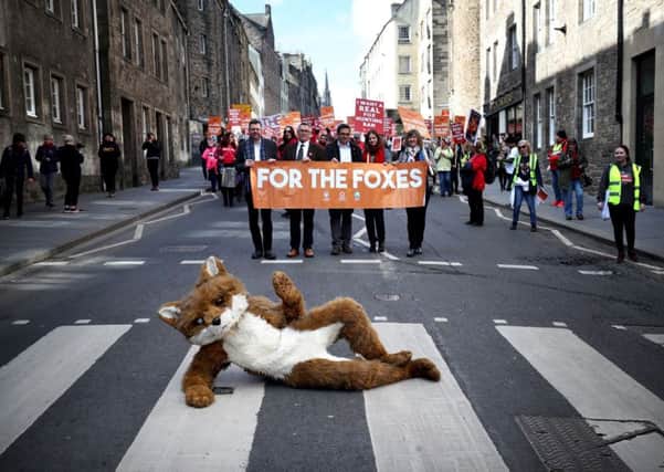 Protesters during a march on the Royal Mile in Edinburgh organised by the League Against Cruel Sports, OneKind and IFAW calling for a "real" fox hunting ban.Photo: Jane Barlow/PA Wire