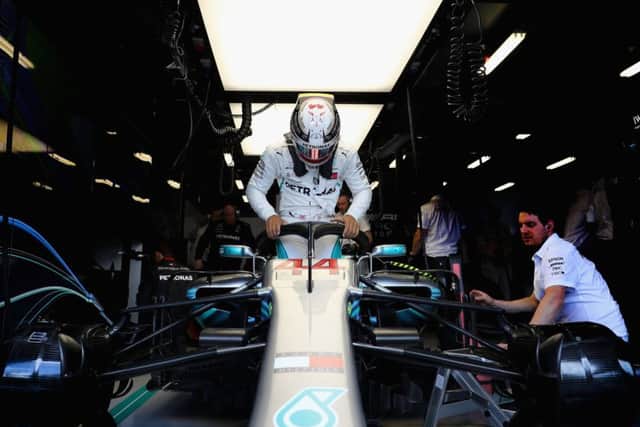 Mercedes' Lewis Hamilton prepares to drive in the garage during final practice for the Australian Grand Prix at Albert Park.  Picture: Mark Thompson/Getty Images