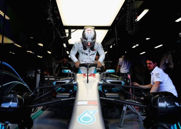 Mercedes' Lewis Hamilton prepares to drive in the garage during final practice for the Australian Grand Prix at Albert Park.  Picture: Mark Thompson/Getty Images