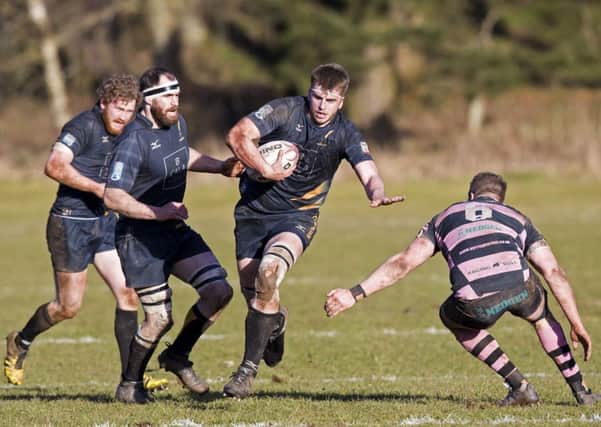 Curries Hamish Bain takes on Blair Macpherson of Ayr during the west of Scotland sides 24-21 victory yesterday. Picture: SNS.