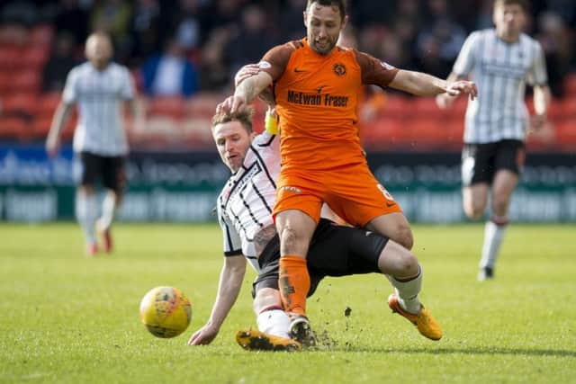 Dundee United scorer Scott McDonald is challenged by Callum Morris. Picture: SNS.