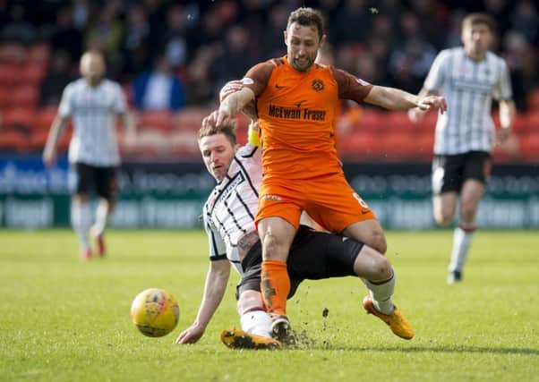 Dundee United scorer Scott McDonald  is challenged by Callum Morris. Picture: SNS.