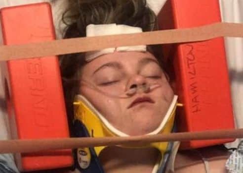 Roisin Walker, 14, is in a serious condition in hospital and has a broken neck