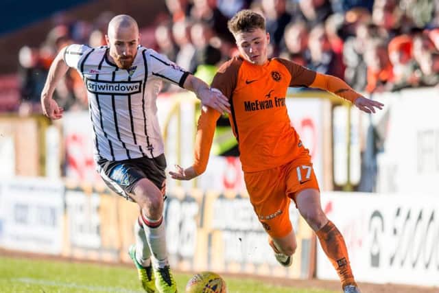 Jamie Robson, right, is one of a batch of talented youngsters lending exuberance to Dundee Uniteds promotion-chasing side. Picture: SNS.