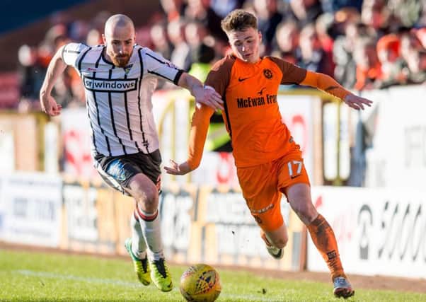 Jamie Robson, right, is one of a batch of talented youngsters lending exuberance to Dundee Uniteds promotion-chasing side. Picture: SNS.