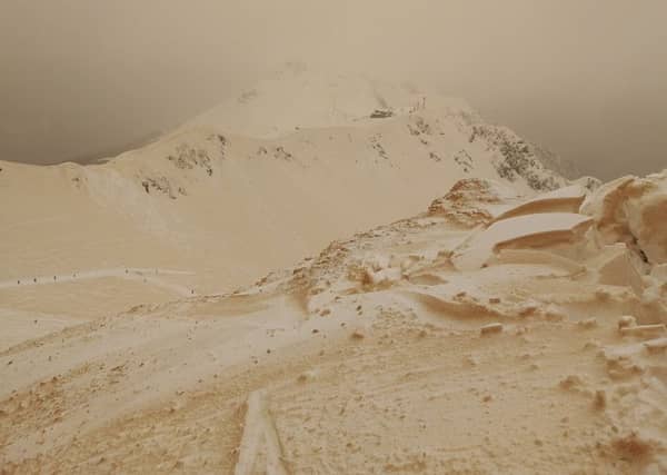 Orange snow has fallen in parts of eastern Europe after a rare meeting of Siberia and the Sahara. (Margarita Alshina via AP)