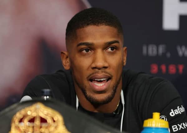 Anthony Joshua speaks ahead of his world heavyweight title unification fight against New Zealand's Joseph Parker. Picture: Daniel Leal-Olivas/AFP/Getty Images