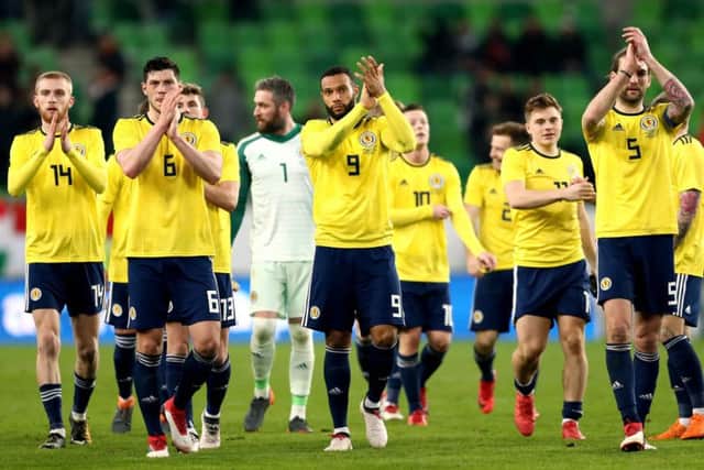 Scotland's Oliver McBurnie, Scott McKenna, Matt Phillips and Charlie Mulgrew applaud the fans after winning 1-0 against Hungary. Picture: Tim Goode/PA Wire