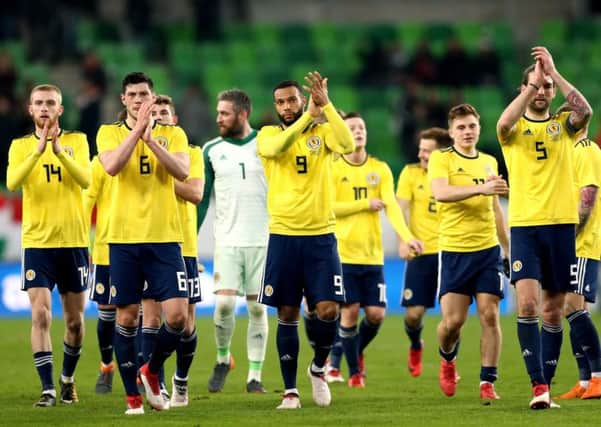 Scotland's Oliver McBurnie, Scott McKenna, Matt Phillips and Charlie Mulgrew applaud the fans after winning 1-0 against Hungary. Picture: Tim Goode/PA Wire