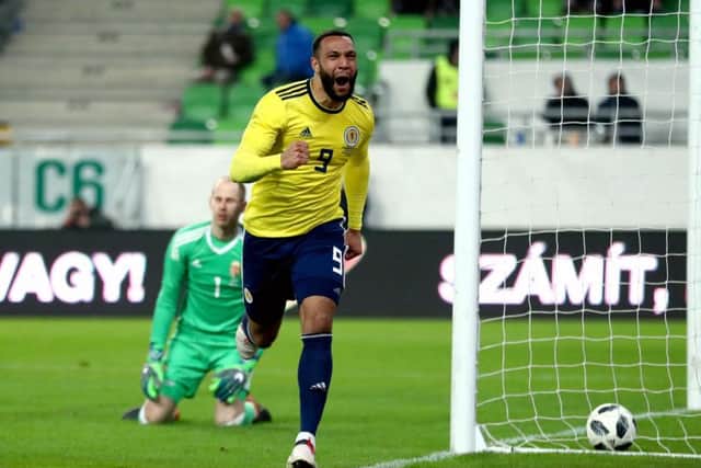 Scotland forward Matt Phillips roars with delight as he races away after stroking the ball past Hungary goalkeeper Peter Gulacsi for the only goal of the game. Picture: Tim Goode/PA