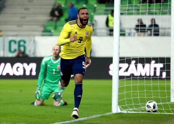 Scotland forward Matt Phillips roars with delight as he races away after stroking the ball past Hungary goalkeeper Peter Gulacsi for the only goal of the game. Picture: Tim Goode/PA