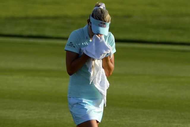 Lexi Thompson cries in a towel as she walks to the 18th green during the final round of last year's ANA Inspiration at Mission Hills. Picture: Robert Laberge/Getty Images