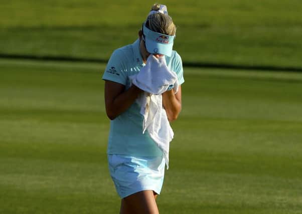 Lexi Thompson cries in a towel as she walks to the 18th green during the final round of last year's ANA Inspiration at Mission Hills. Picture: Robert Laberge/Getty Images