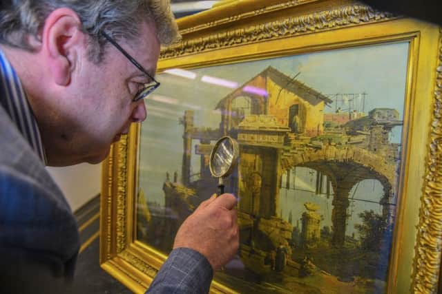 Senior lecturer at the University of Aberdeen, John Gash with The Ruins of a Temple by Canaletto. Pic: PA Wire