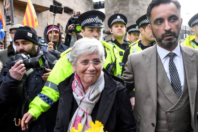 Clara Ponsati surrounded by supporters and lawyer Aamer Amwar after handing herself in at an Edinburgh police station last month. Pic: Jeff J Mitchell/Getty