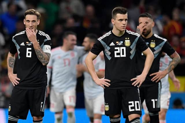 Argentina's Lucas Biglia, Giovani Lo Celso and Nicolas Otamendi look stunned after Spain's sixth goal during Tuesday's friendly in Madrid. Picture: AFP/Getty