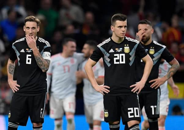 Argentina's Lucas Biglia, Giovani Lo Celso and Nicolas Otamendi look stunned after Spain's sixth goal during Tuesday's friendly in Madrid. Picture: AFP/Getty