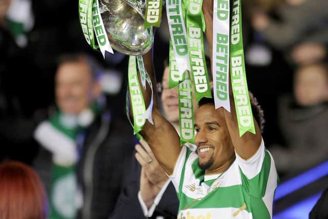 Scott Sinclair lifts the Betfred Cup trophy, one of four he's won during his time at Celtic Park. Picture: Michael Gillen