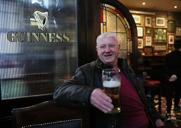 Jim Croke enjoys an early pint on Good Friday as legislation was passed earlier this year to allow pubs to serve alcohol. Pic: Brian Lawless/PA Wire