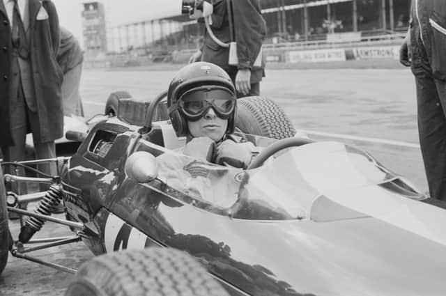 Jim Clark, in his Lotus 25 Climax V8, makes a pit stop during the British Grand Prix at Silverstone in 1963. Picture: Victor Blackman/Daily Express/Hulton Archive/Getty Images