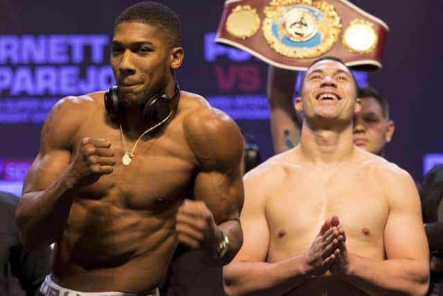 Anthony Joshua, left, and Joseph Parker at the weigh-in ahead of their world heavyweight unification clash in Cardiff: Picture: Getty