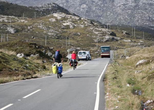 Cyclists have to contend with increasingly fast and heavy traffic on the West Coast and the islands. Picture: Getty Images
