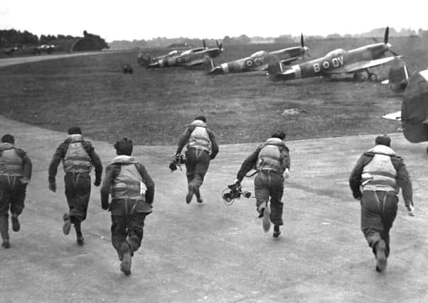 Second World War fighter pilots recreate a 'scramble' at Biggin Hill airfield in Kent in 1946 (Picture: PA)