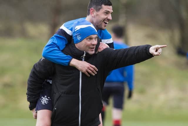 Graham Dorrans gets a lift from Rangers manager Graeme Murty in training. Picture: Paul Devlin/SNS
