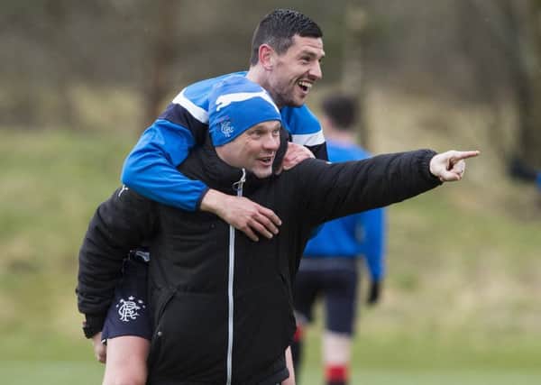 Graham Dorrans gets a lift from Rangers manager Graeme Murty in training. Picture: Paul Devlin/SNS