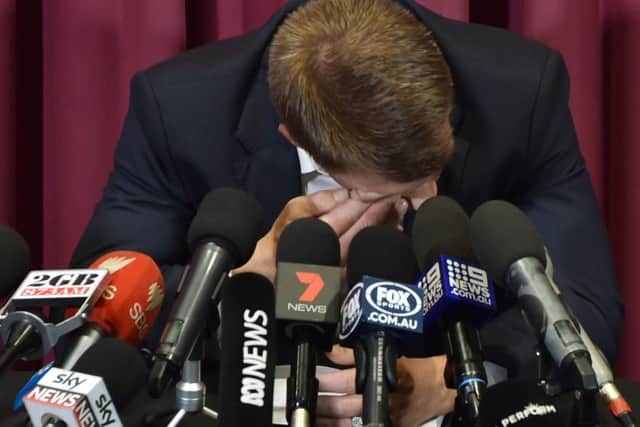 David Warner in tears at a press conference at the SCG yesterday. Picture: AFP/Getty.