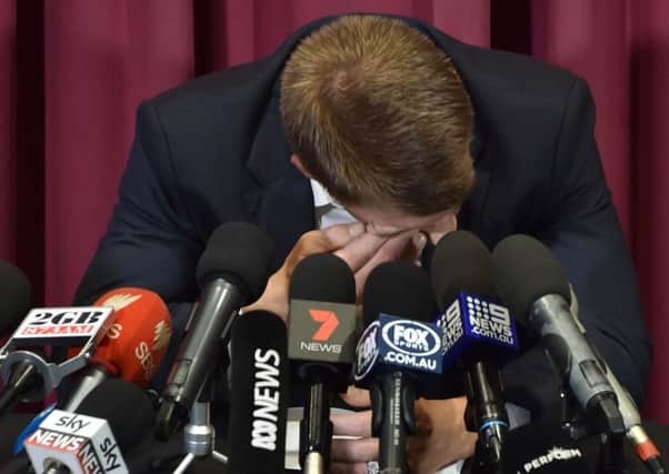 David Warner in tears at a press conference at the SCG yesterday. Picture: AFP/Getty.
