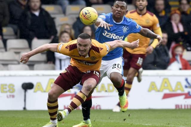 Motherwell'ss Tom Aldred (left) and Rangers' Alfredo Morelos battle for the ball. Picture: Ian Rutherford/PA Wire