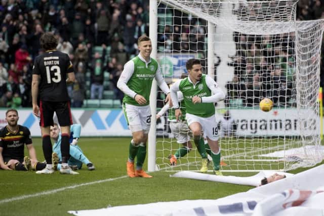 Hibernian's Jamie MacLaren celebrates Hibs' first goal. Picture: SNS/Ross Parker