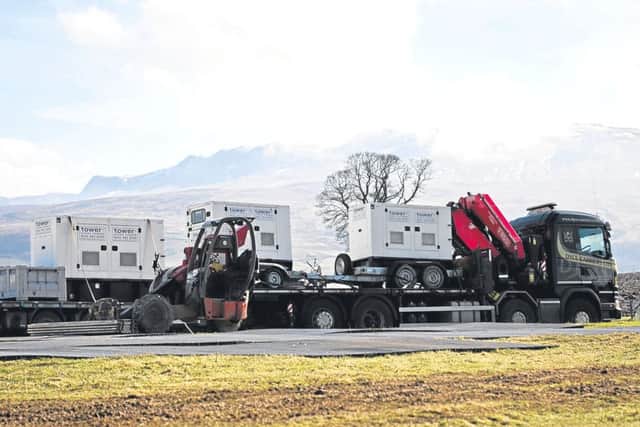 Warner Bros lorries and production equipment packing up as filming finishes on the new Pokemon movie. Pic: John Jeffay/Cascade News