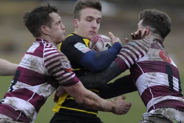 Mike Fedo and  Rory Hutton of Watsonians combine to halt Ross McCanns progress. Picture: Neil Hanna