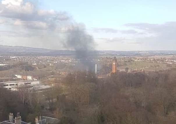 Thick smoke can be seen billowing from the disused Stobhill Hospital in Glasgow. Pic: Charles Webster