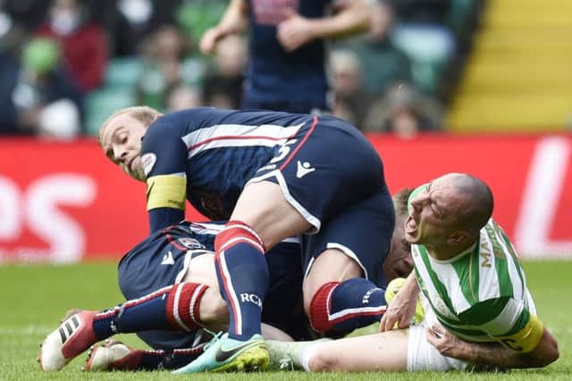 Andrew Davies appears to stamp his boot in Scott Brown's groin. Picture: SNS