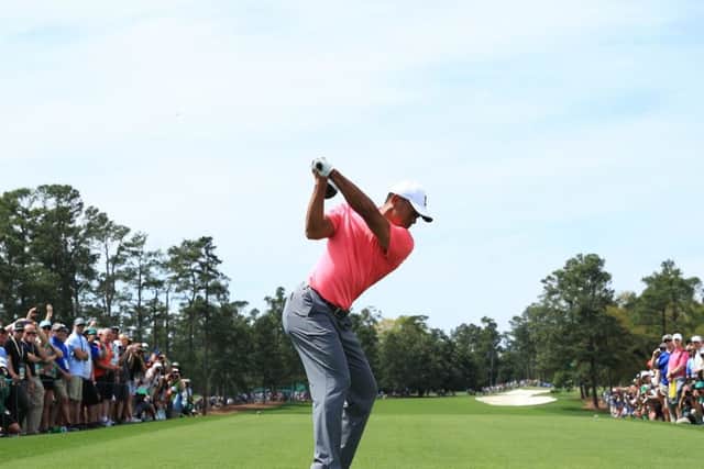 Tiger Woods tees off at the first during a practice round on Monday in the build up to the Masters. Picture: Getty Images
