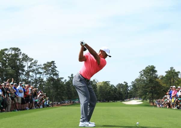 Tiger Woods tees off at the first during a practice round on Monday in the build up to the Masters. Picture: Getty Images