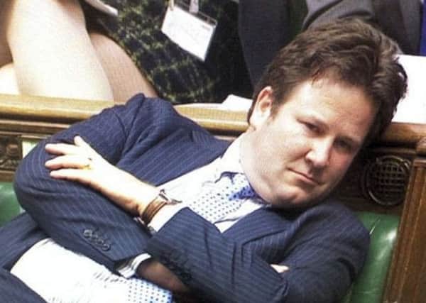 Listening, not sleeping: this image shows partially deaf Tory MP Alec Shelbrooke listening to speakers in the Commons' benches, another image with his eyes apparently closed was used to wrongly suggest he was sleeping