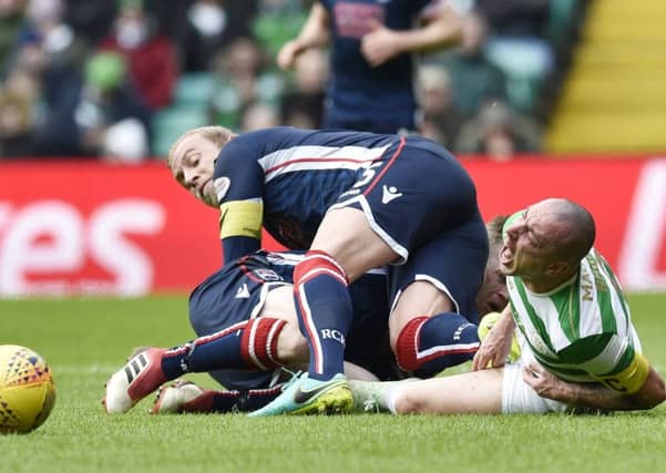Andrew Davies was sent off for a challenge on Scott Brown during Celtic's win over Ross County. Picture: SNS