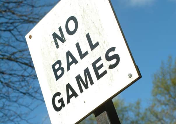 Plea to remove killjoy "No Ball Games" signs.