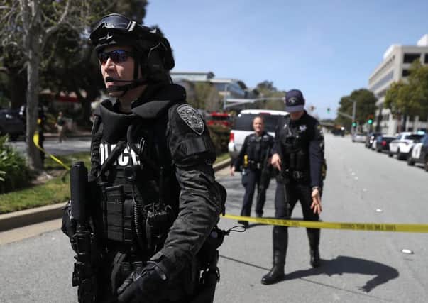 Law enforcement stands watch outside of the YouTube headquarters. Pic: Getty Images