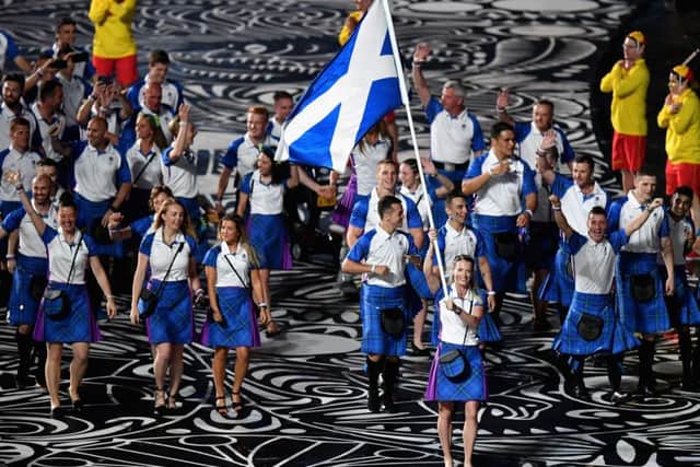Eilidh Doyle, flag bearer of Scotland arrives with Scotland team during the Opening Ceremony for the Gold Coast 2018 Commonwealth Games. (Photo by Dan Mullan/Getty Images)