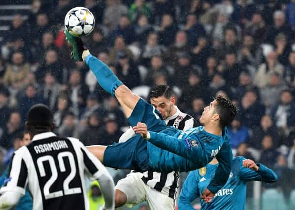 Cristiano Ronaldo scores with a brilliant overhead kick for Real Madrid against Juventus. Picture: Alberto Pizzoli/AFP/Getty Images